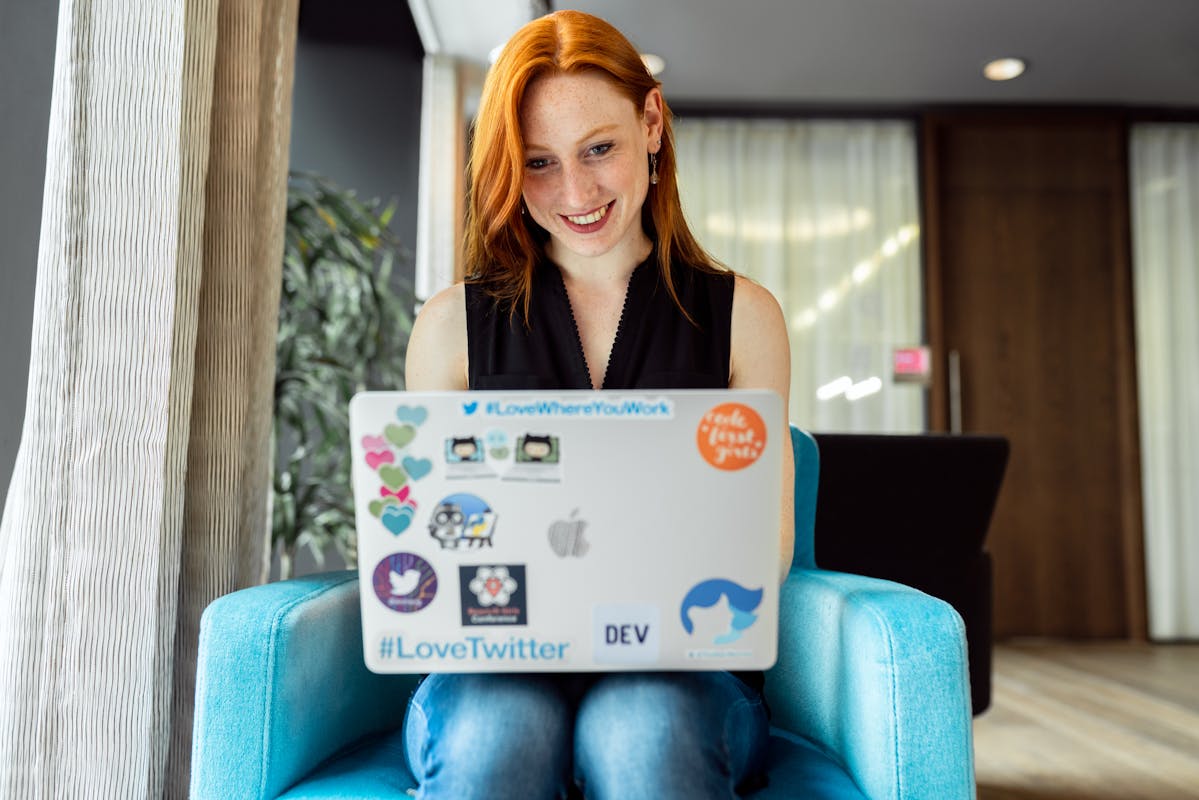 Professional working remotely on a laptop from a home office setup