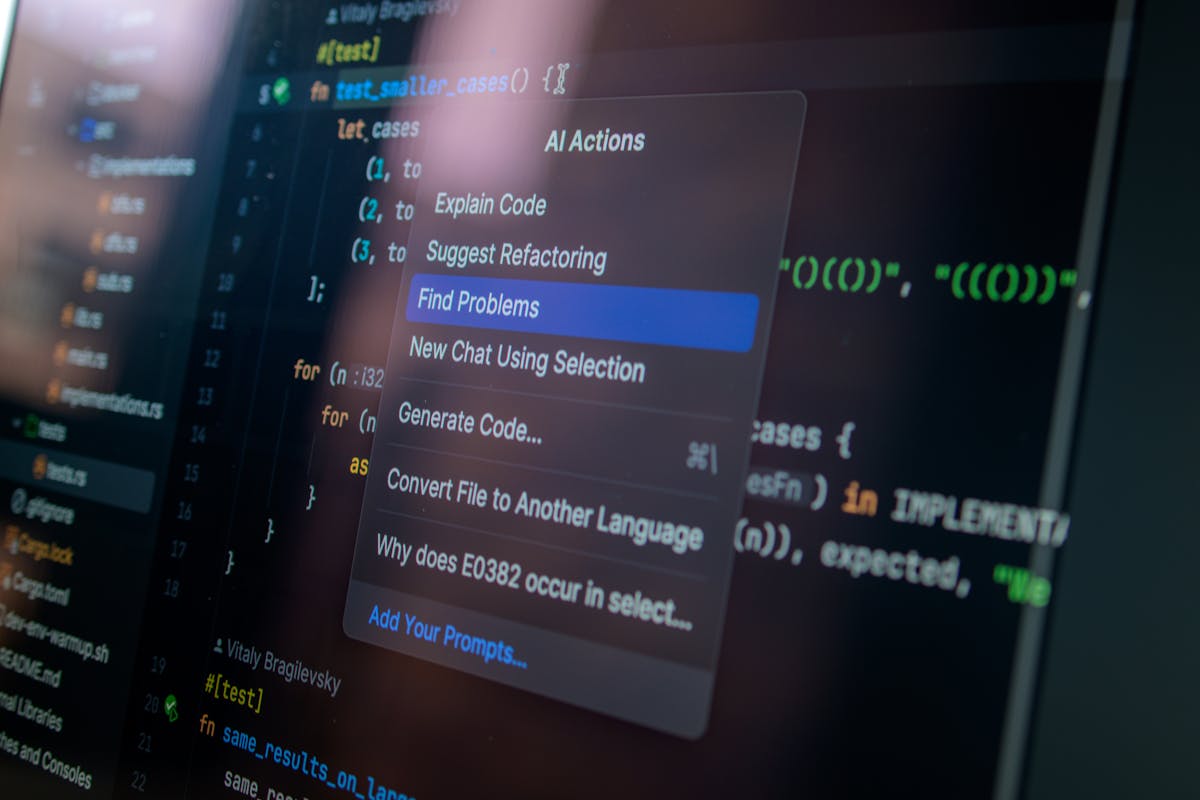 Computer screen displaying AI-assisted code editor with development tools