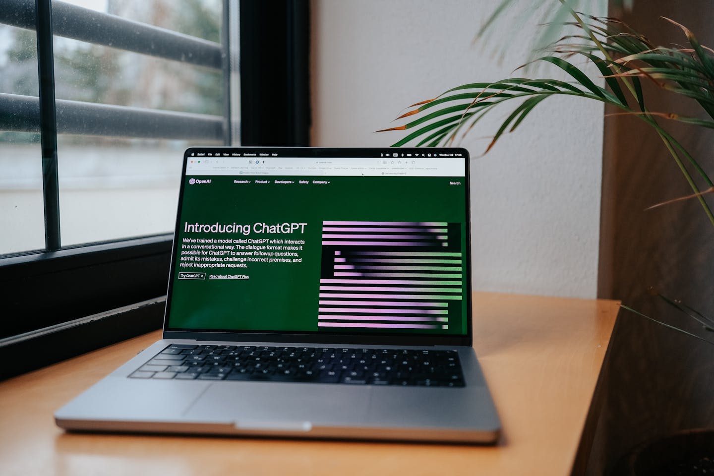 Modern home office setup with laptop displaying AI tools