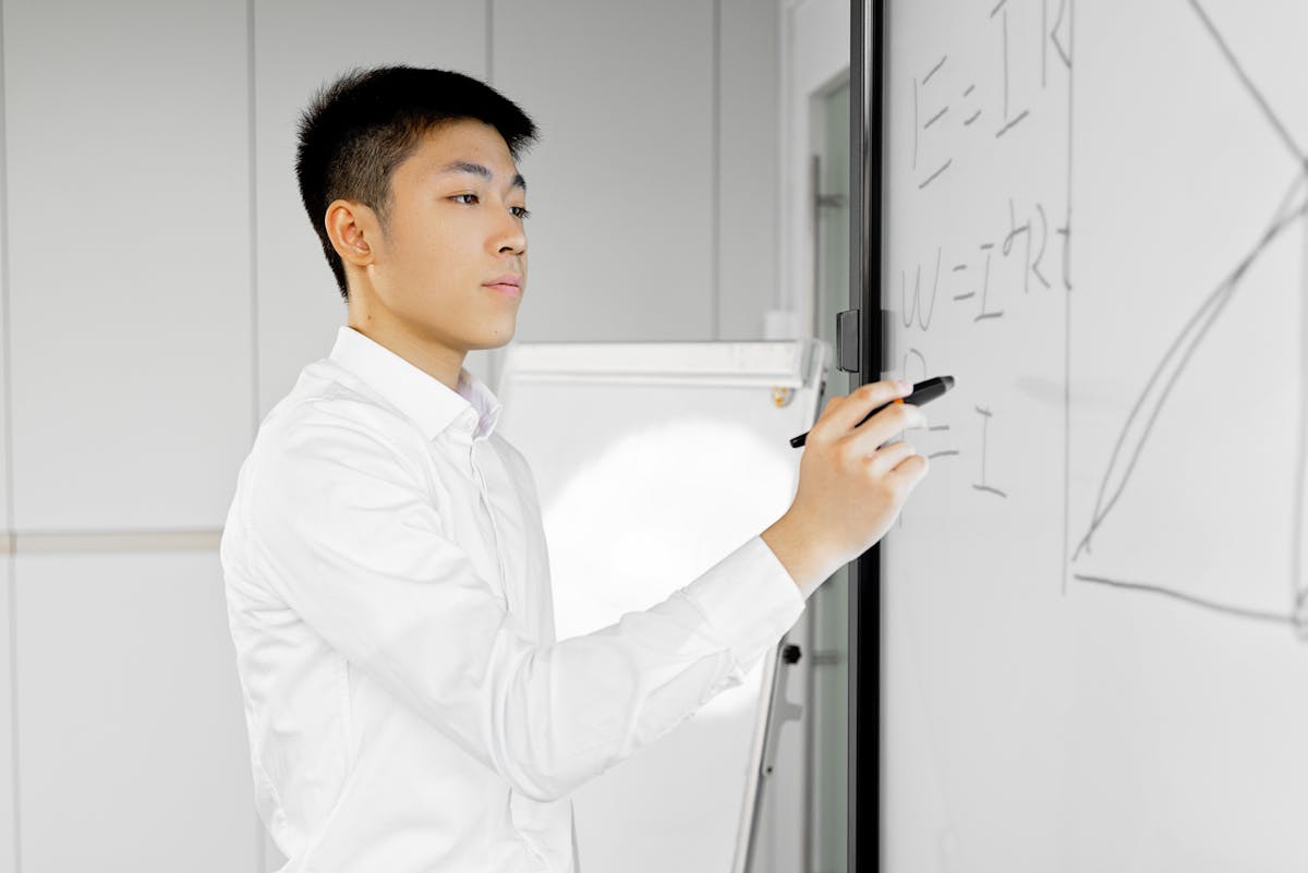 Engineer working through technical diagrams on a digital whiteboard during remote interview prep